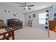 Cozy Bedroom with a ceiling fan, featuring a crib and changing table and soft decor at 1301 Torrey Pines Ct, Mebane, NC 27302