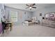 Bright, carpeted bedroom featuring a bed and dresser with ample space to spread out at 1301 Torrey Pines Ct, Mebane, NC 27302