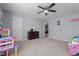 Bedroom with carpet, ceiling fan, neutral walls, and a view to an open doorway at 1301 Torrey Pines Ct, Mebane, NC 27302