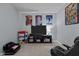 Comfortable carpeted bedroom perfect for a kid, featuring a media center and fun decorations at 1301 Torrey Pines Ct, Mebane, NC 27302