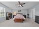 Comfortable bedroom with a large window, neutral walls, and a wood chest for storage at 1301 Torrey Pines Ct, Mebane, NC 27302