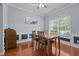 Traditional dining room with wood floors, light-blue walls, and wainscoting at 1301 Torrey Pines Ct, Mebane, NC 27302
