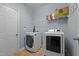Functional laundry room with modern washer and dryer at 1301 Torrey Pines Ct, Mebane, NC 27302