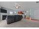 Inviting living room features a cozy fireplace and blends into a modern kitchen with light gray walls at 1301 Torrey Pines Ct, Mebane, NC 27302
