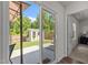 View of backyard with shed, accessed through sliding glass door and featuring well-maintained lawn and privacy fence at 1574 Dorsett Ln, Creedmoor, NC 27522