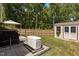 Picturesque backyard featuring a shed, a generator and a wooden fence offering privacy and security at 1574 Dorsett Ln, Creedmoor, NC 27522