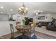 Inviting dining area showing the round table, living room, and the modern kitchen at 1574 Dorsett Ln, Creedmoor, NC 27522