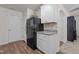 Functional kitchen area with black refrigerator, white cabinets, and granite countertops for a modern touch at 1574 Dorsett Ln, Creedmoor, NC 27522