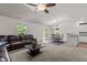 Cozy living room open to dining and kitchen with neutral carpet and ample natural light at 1574 Dorsett Ln, Creedmoor, NC 27522