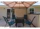 Inviting patio with seating, ideal for enjoying outdoor meals and relaxing in a charming setting at 1574 Dorsett Ln, Creedmoor, NC 27522