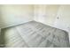 A spacious bedroom with neutral walls and plush gray carpet at 158 Sourgum Ct, Zebulon, NC 27597