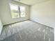 Bedroom featuring neutral paint, carpeting, and natural light at 158 Sourgum Ct, Zebulon, NC 27597