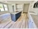 Modern kitchen featuring white cabinets, stainless appliances, granite countertops, and center island at 158 Sourgum Ct, Zebulon, NC 27597