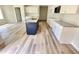 Modern kitchen featuring white cabinets, stainless appliances, granite countertops, and center island at 158 Sourgum Ct, Zebulon, NC 27597