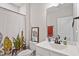 Bright bathroom featuring modern fixtures, vanity and mirror, and a shower with whimsical curtain at 164 Wilson Farm Ln, Clayton, NC 27527