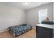 bedroom featuring wood flooring, a dresser, and a window providing natural light at 164 Wilson Farm Ln, Clayton, NC 27527
