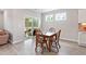 Charming dining area featuring a wooden table and easy access to a screened porch at 164 Wilson Farm Ln, Clayton, NC 27527