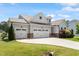 Lovely home with an attached three car garage and well-manicured lawn at 164 Wilson Farm Ln, Clayton, NC 27527