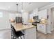 Well-equipped kitchen featuring a central island, granite countertops, and stainless steel appliances at 164 Wilson Farm Ln, Clayton, NC 27527