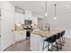 Stylish kitchen with a breakfast bar, granite countertops, and stainless steel appliances at 164 Wilson Farm Ln, Clayton, NC 27527