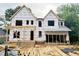 Image of a home's construction showing the framing and initial structure before completion at 1807 Ridley St, Raleigh, NC 27608