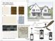 Exterior design scheme featuring white trim and siding, a metal roof, and flagstone porch at 1807 Ridley St, Raleigh, NC 27608