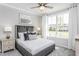 Bright bedroom featuring large window with neighborhood view and coordinated decor at 1825 Angelonia Way, Fuquay Varina, NC 27526