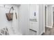 Mudroom with convenient coat rack and bench, plus entry to laundry room with storage at 1825 Angelonia Way, Fuquay Varina, NC 27526