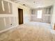 Well-lit bedroom featuring a door and large window at 188 Buckaroo Dr, Louisburg, NC 27549