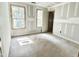 Spacious bedroom featuring two windows and a door, ready for personalization at 188 Buckaroo Dr, Louisburg, NC 27549