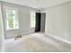 New bedroom featuring lots of natural light and neutral wall color at 188 Buckaroo Dr, Louisburg, NC 27549