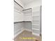 Walk-in closet with built-in shelving and carpet at 188 Buckaroo Dr, Louisburg, NC 27549