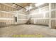 Unfinished garage space ready for customization, featuring a concrete floor and stairway at 188 Buckaroo Dr, Louisburg, NC 27549