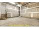 Spacious unfinished garage area with concrete flooring and a stairway to another level at 188 Buckaroo Dr, Louisburg, NC 27549