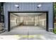 Spacious unfinished garage featuring concrete floor, stairway, and room for vehicles or storage at 188 Buckaroo Dr, Louisburg, NC 27549