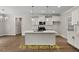 Contemporary kitchen boasts an island, sleek cabinets, and stainless steel appliances at 188 Buckaroo Dr, Louisburg, NC 27549