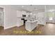 Stylish kitchen showcasing white cabinets, modern appliances, sleek countertops, and an island layout at 188 Buckaroo Dr, Louisburg, NC 27549