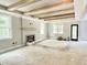 Open living room featuring a fireplace, a beamed ceiling and lots of light at 188 Buckaroo Dr, Louisburg, NC 27549