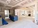 Bright open-concept living space featuring a fireplace and easy access to the modern kitchen at 188 Buckaroo Dr, Louisburg, NC 27549