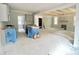 An open concept living area with unfinished kitchen, living room and fireplace at 188 Buckaroo Dr, Louisburg, NC 27549