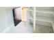 Spacious pantry with white shelving, and access door at 188 Buckaroo Dr, Louisburg, NC 27549