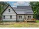 Exterior rear view of house showcasing vinyl siding, windows, and a wooden back deck at 188 Buckaroo Dr, Louisburg, NC 27549