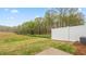 Fenced backyard with new lawn, patio, and view of rear exterior of the house at 1901 Hinesley Dr, Durham, NC 27703