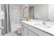 Clean bathroom with large mirror, bathtub, and stylish sink at 1901 Hinesley Dr, Durham, NC 27703