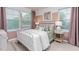 Bright bedroom featuring a large window, plush bedding, and stylish decor at 1901 Hinesley Dr, Durham, NC 27703
