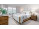 Bright bedroom featuring a large window, plush bedding, and stylish decor at 1901 Hinesley Dr, Durham, NC 27703