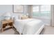 Cozy bedroom featuring a large window, plush bedding, and stylish decor at 1901 Hinesley Dr, Durham, NC 27703