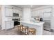 Modern kitchen with stainless steel appliances, granite countertops, and breakfast bar at 1901 Hinesley Dr, Durham, NC 27703