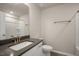 Bathroom with granite countertops, a white vanity, and a shower/tub combo at 1905 Hinesley Dr, Durham, NC 27703