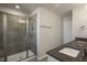 Bathroom with a tiled shower, glass door, and granite countertops at 1905 Hinesley Dr, Durham, NC 27703